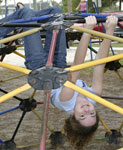 Upside-down on jungle gym